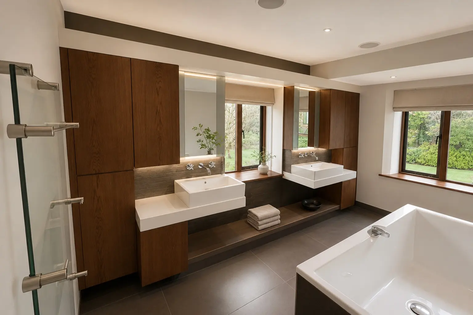 Principal bathroom with bespoke dark timber cabinetry