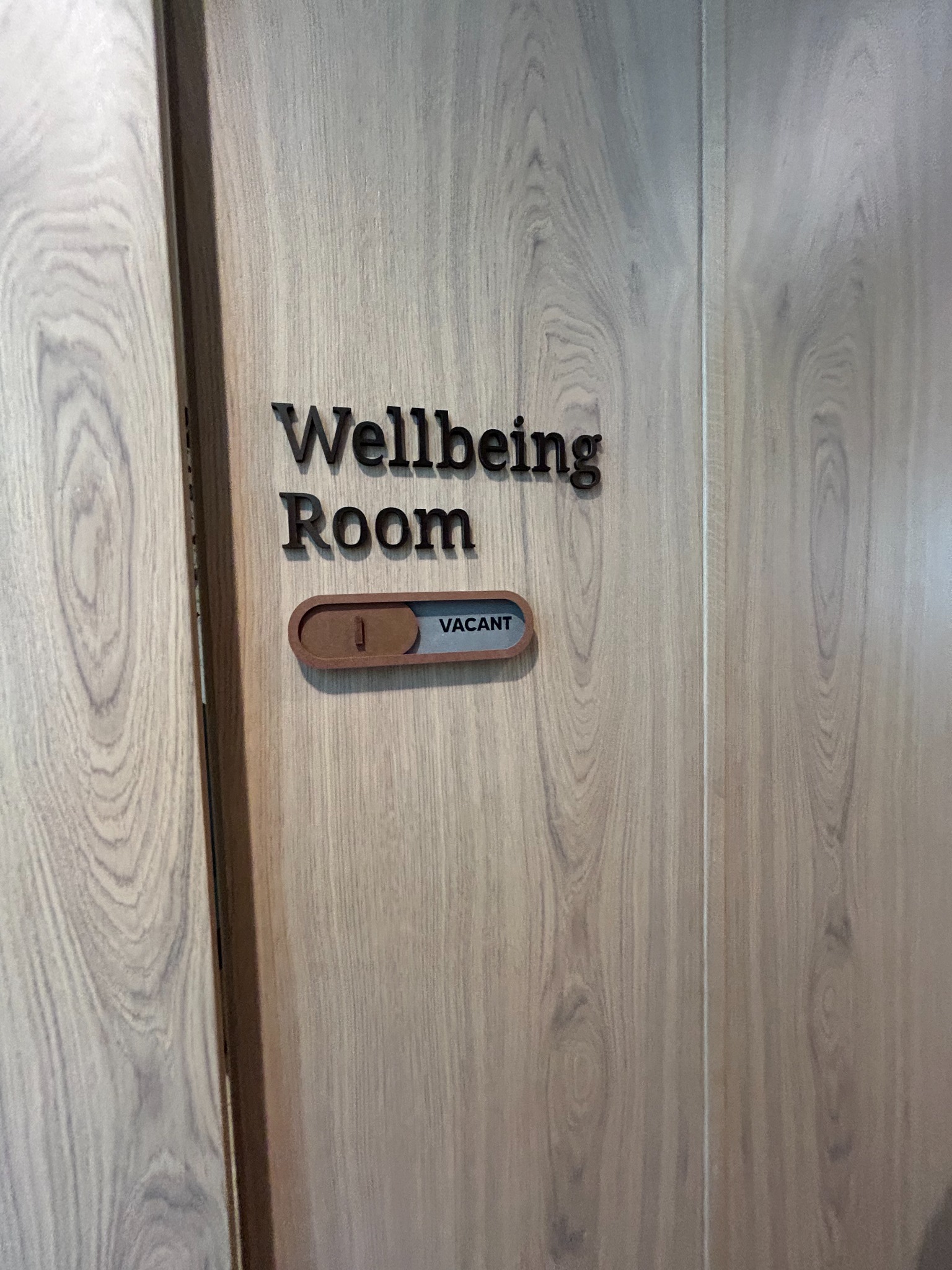 Oak door and availability sign for the workplace wellbeing room