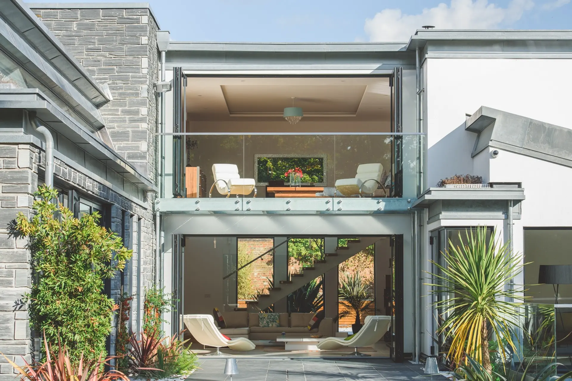 Double-height living space opening to the garden